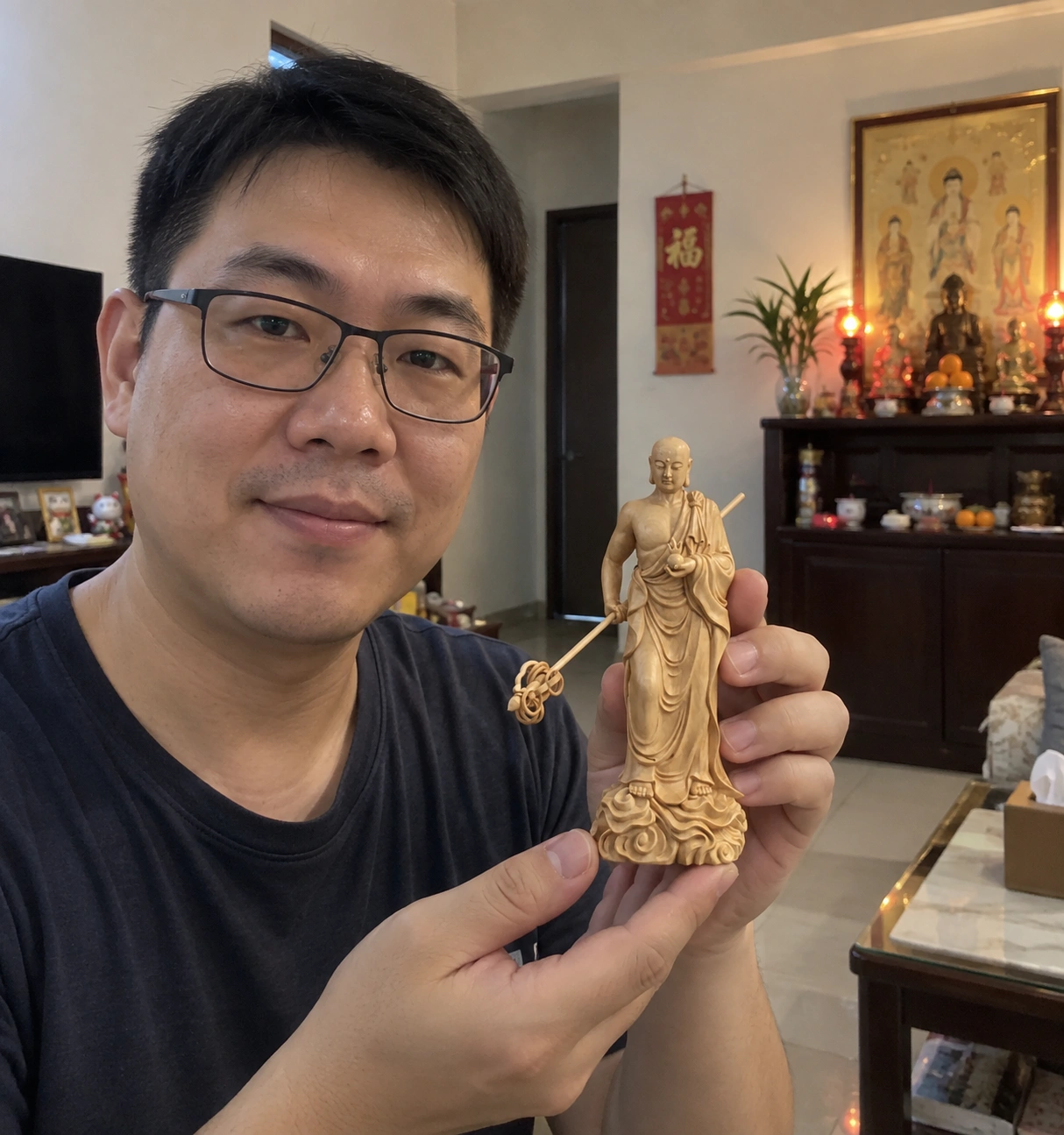 Ksitigarbha Dizang Wang Statue – Hand-Carved Boxwood, 15 cm held in a home setting