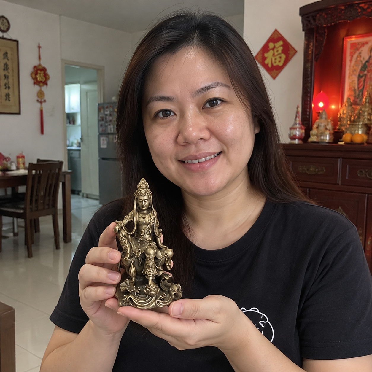 Guanyin 观音菩萨 antique bronze statue in a home setting